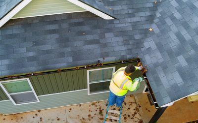 View from above showing a worker doing gutter installation for Rochester Roofing of Minnesota